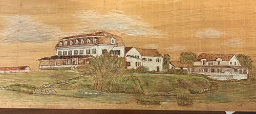 Hand‑burned mahogany wood panel depicting Atlantic Inn on Block Island with shingled architecture and manicured lawn.